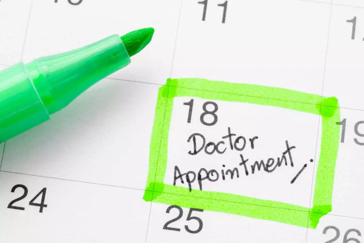 Close up on calendar with doctor's appointment reminder 