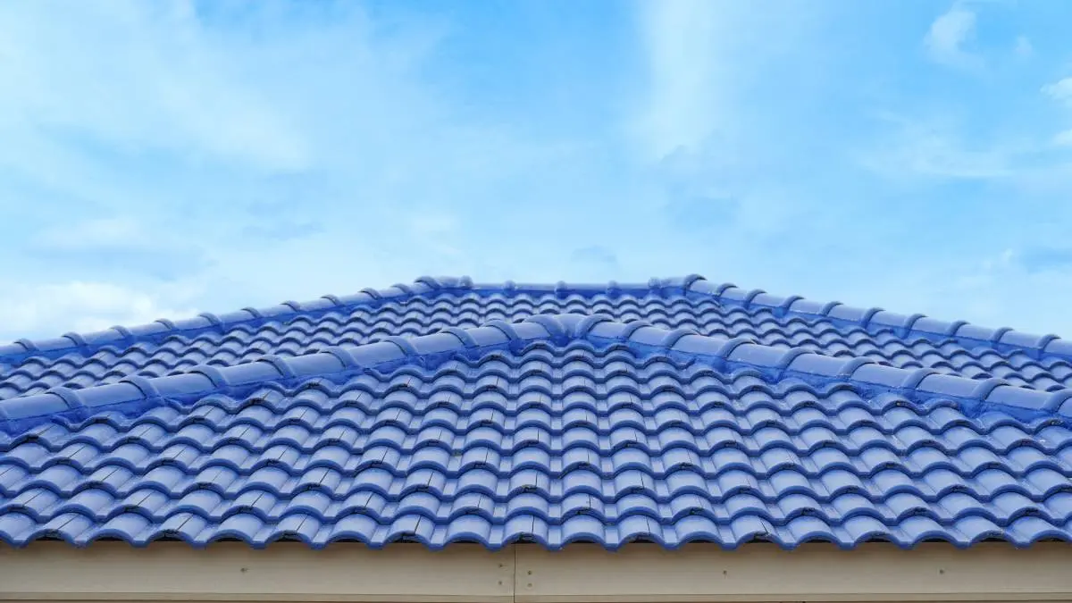 blue tiled roof with a clear blue sky in the background