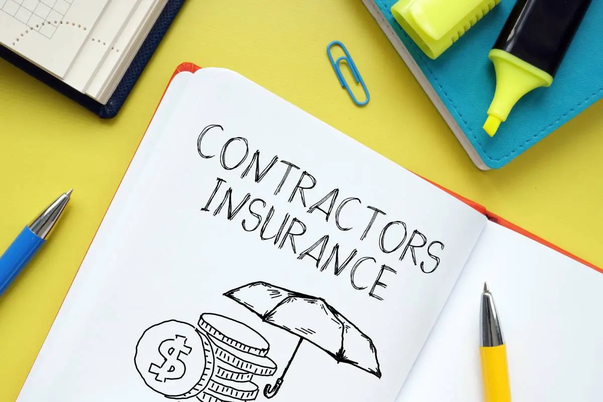 a notebook with contractors insurance, stacked coins with a dollar sign, and an umbrella scribbled in it against a yellow background surrounded by a highlighter, pen, and paper clip