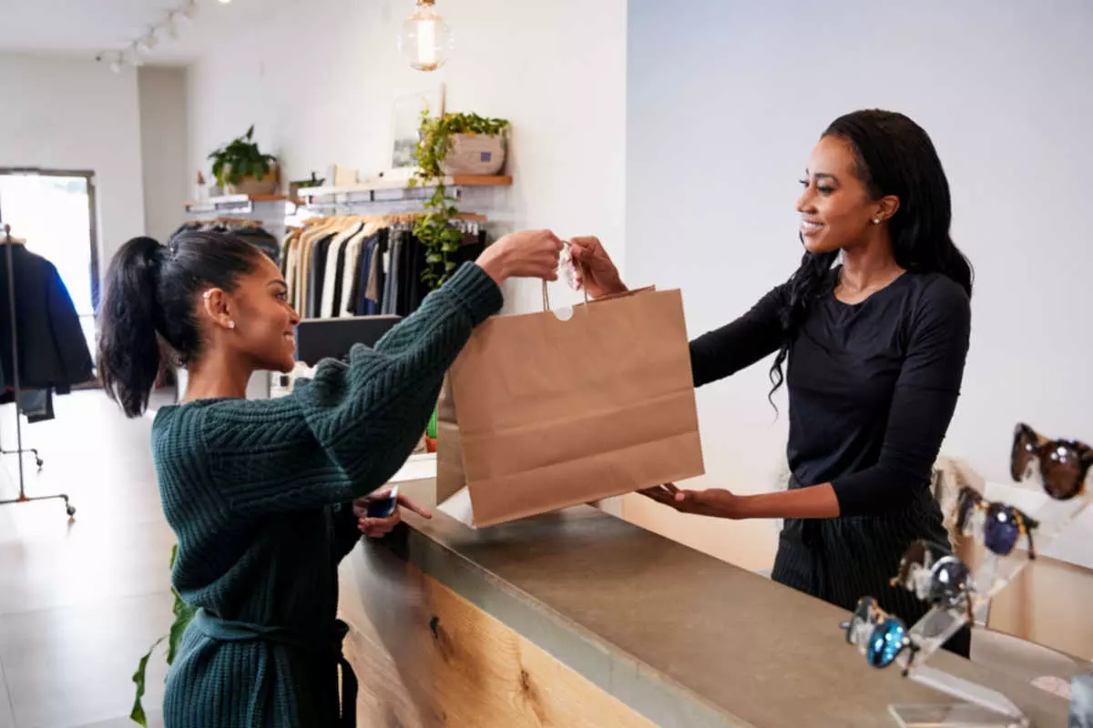 Retail employee helping customer 