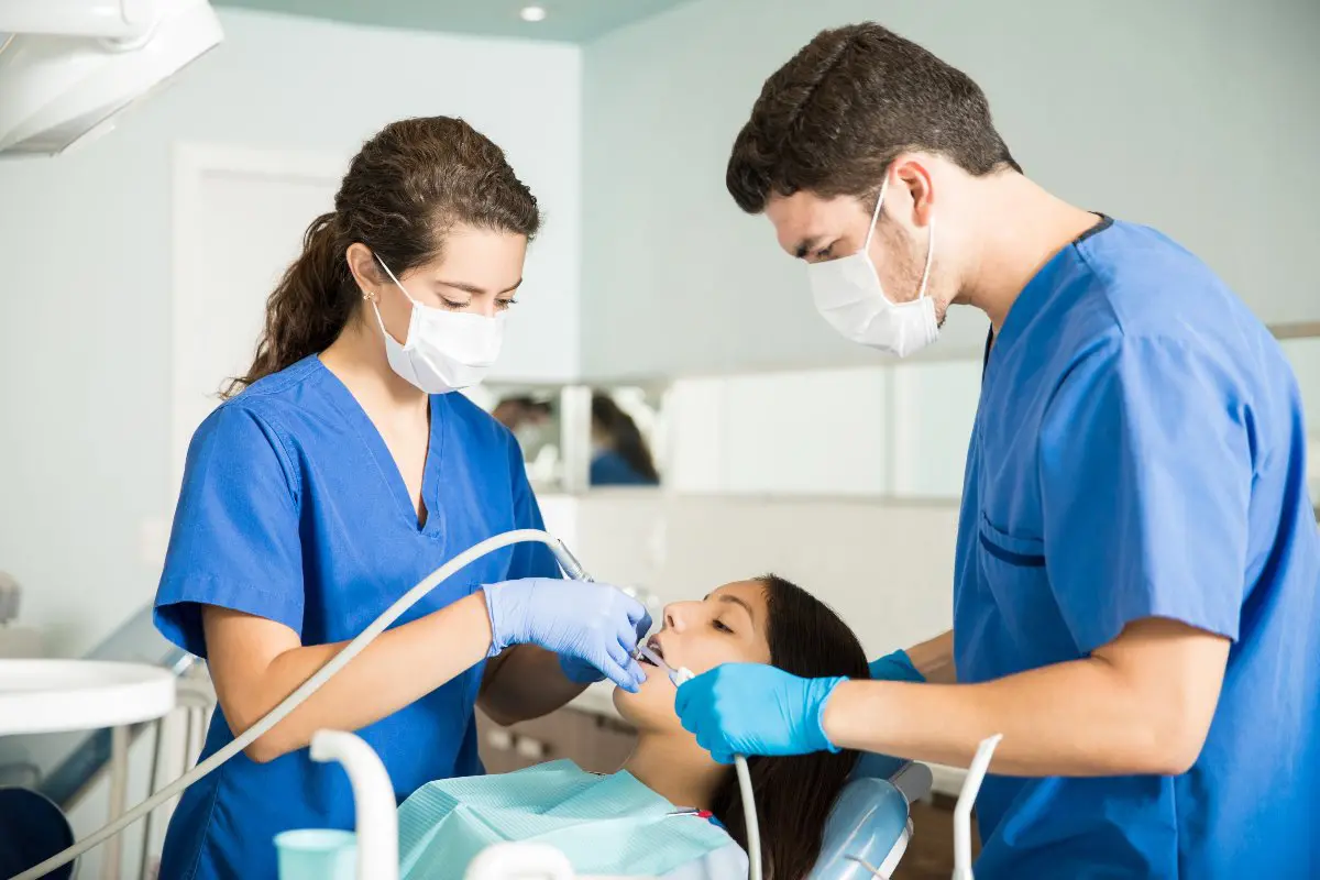 Dentist training dental assistant