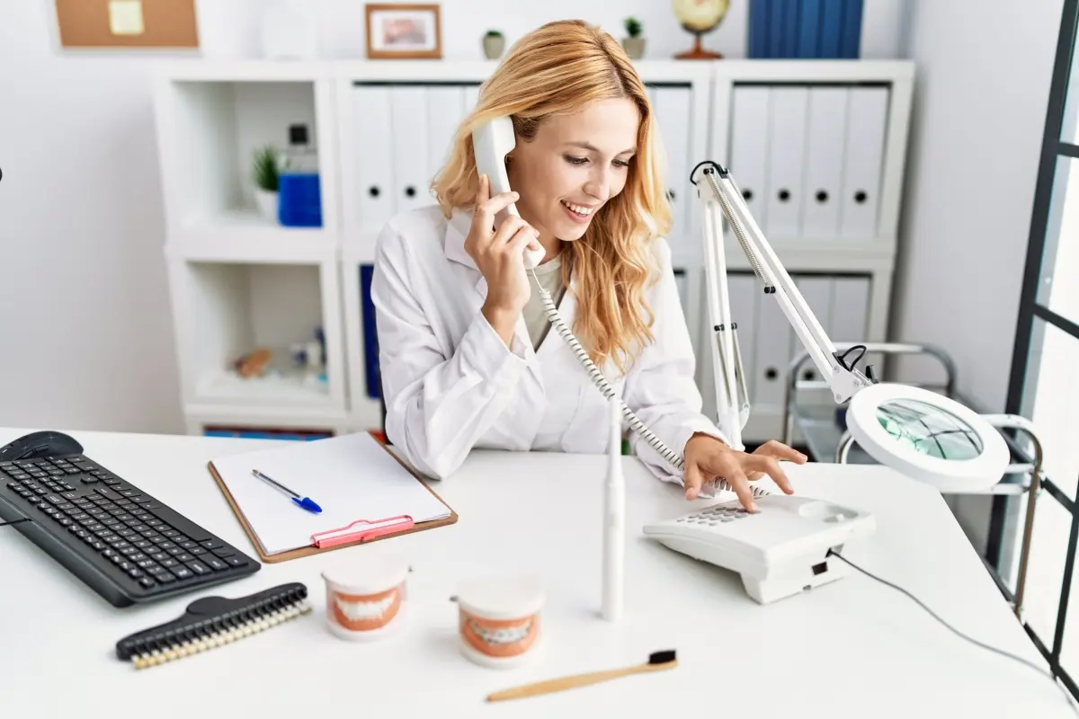 Dental receptionist doing telemarketing