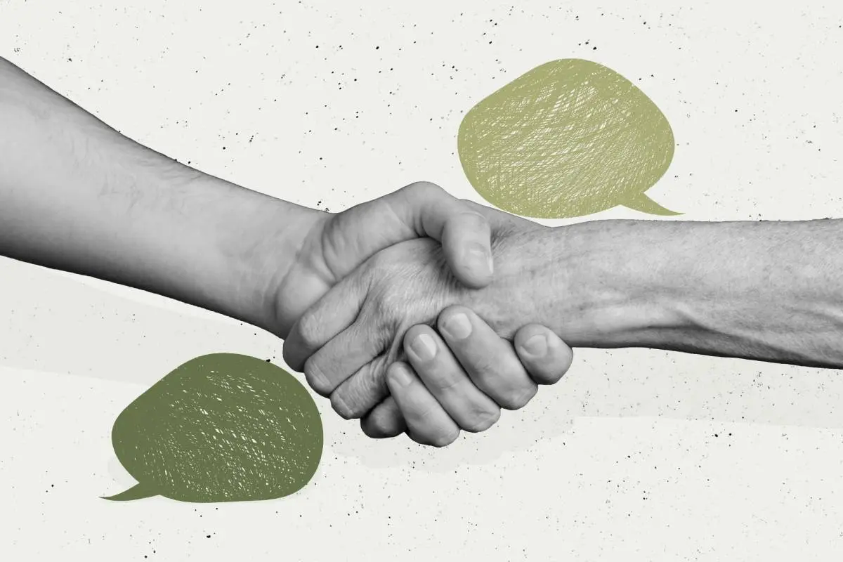 a homeowner and a contractor shaking hands  after signing an agreement with green dialogue symbols behind them