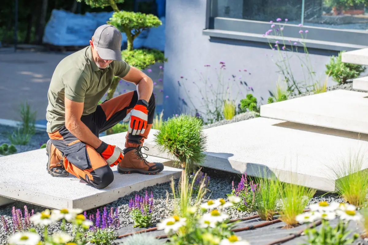 Landscaper installing hardscaping 