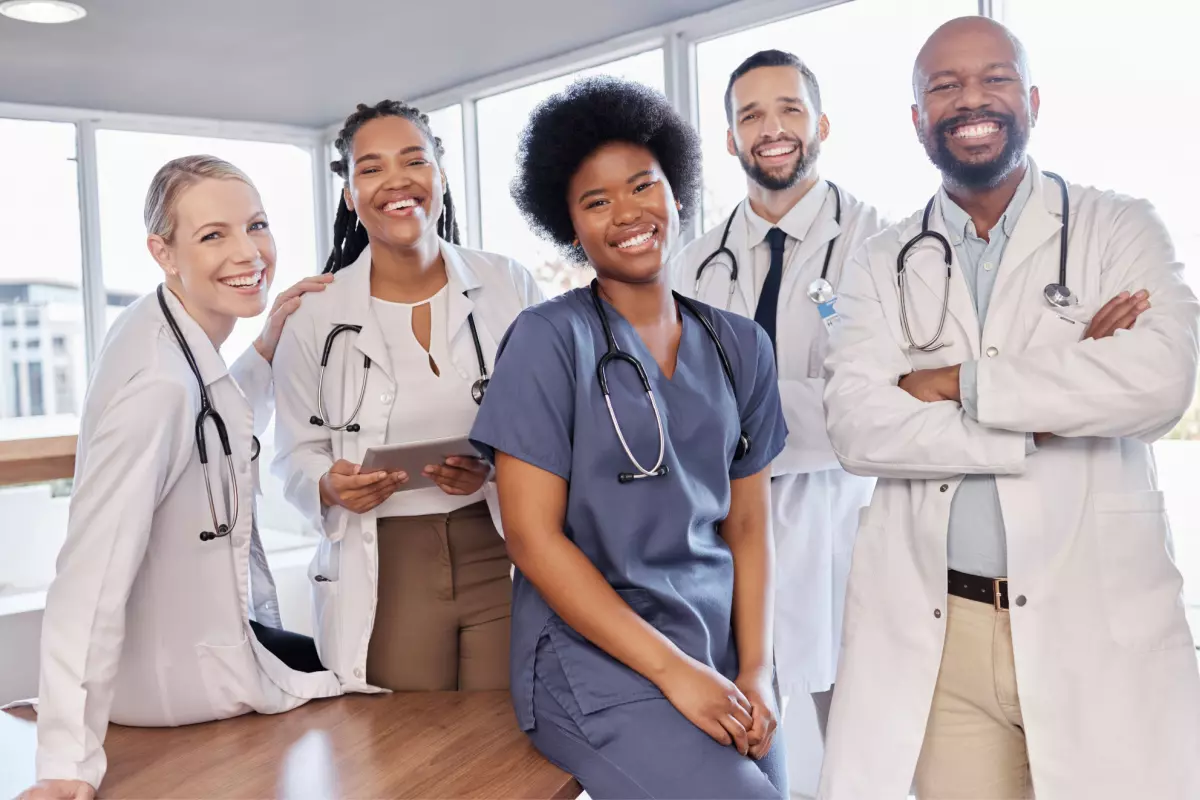 Healthcare providers posing and smiling