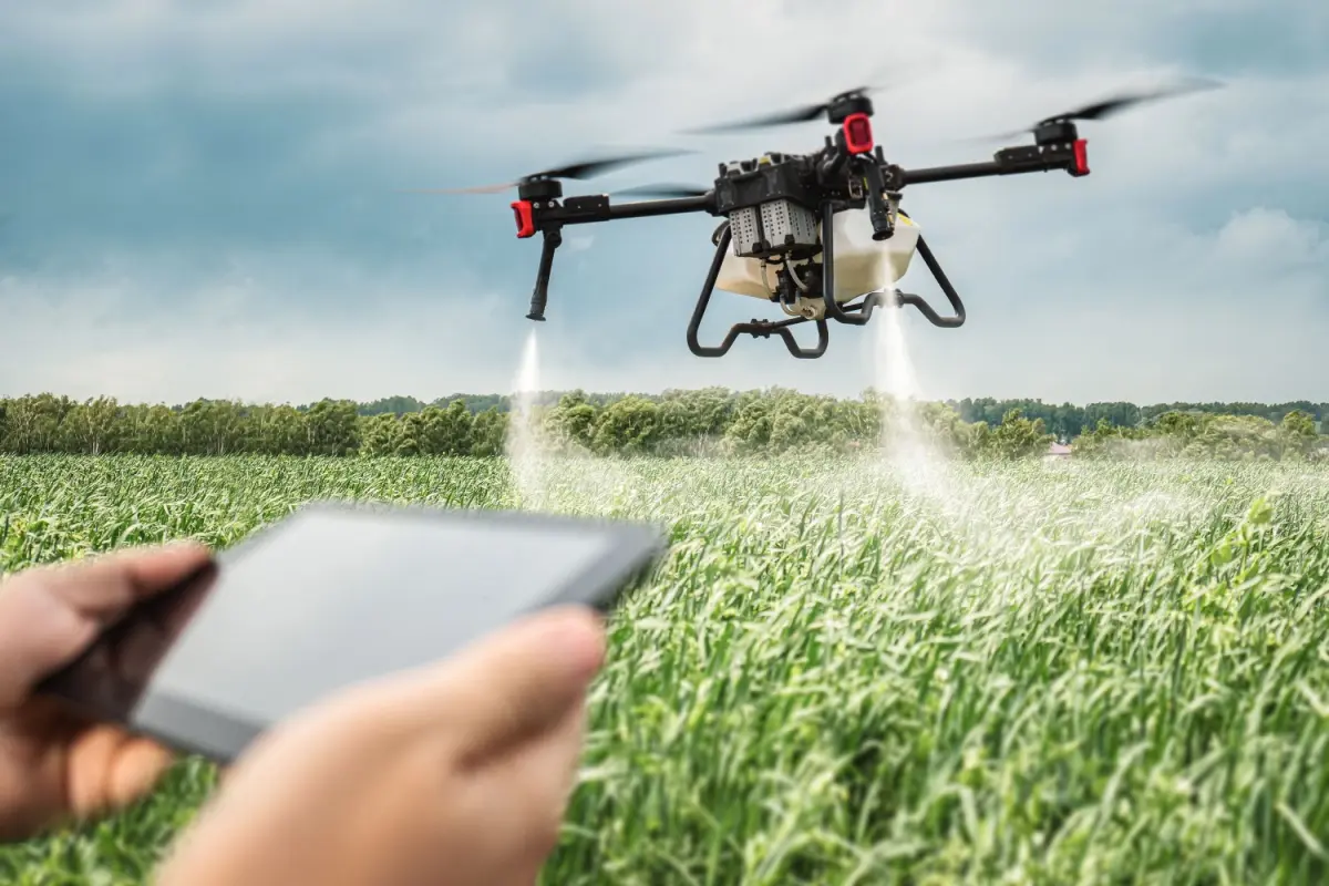 Pest control drone flying over field.