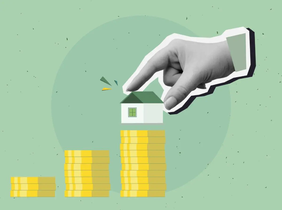 three stacks of coins and a hand putting a house with a green roof as seen at roofing conventions and roofing events on the highest stack of coins