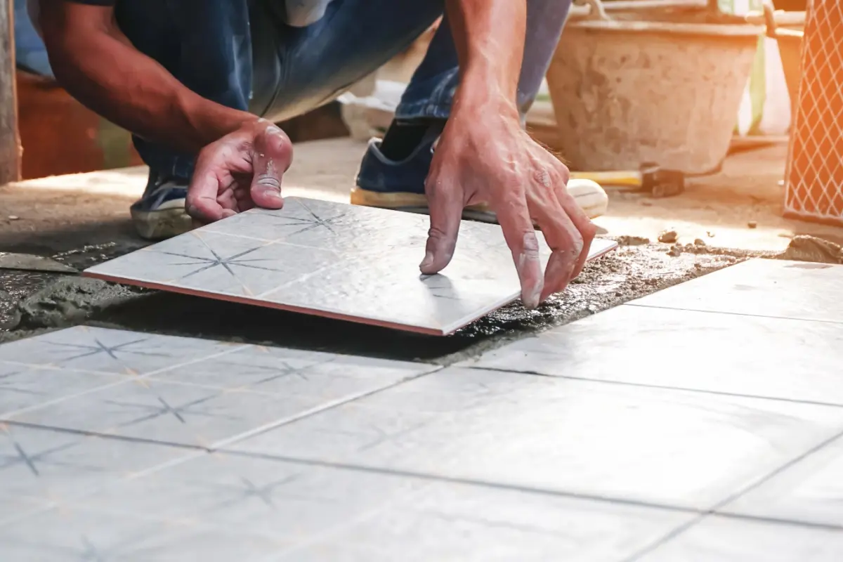 Tile installation during home renovation.